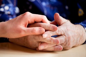 caregiver with elderly hands